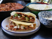 Chicken tinga tacos are easy to make and depending on the toppings offered, totally customizable.