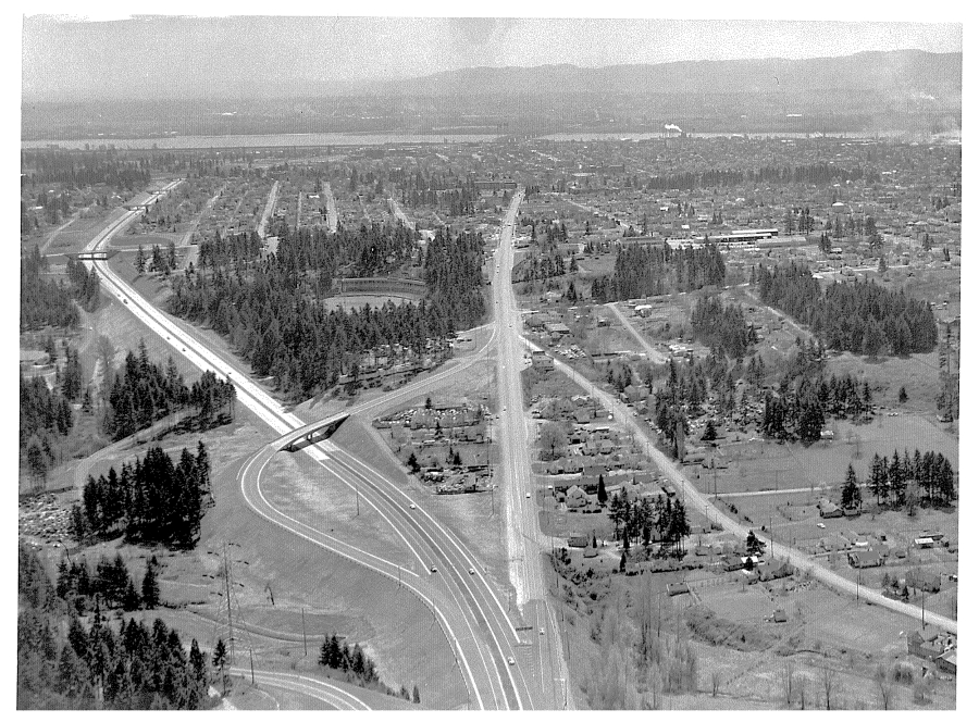 This aerial photo looks south at ongoing Interstate 5 construction in 1953. Kiggins Bowl is visible in the center.