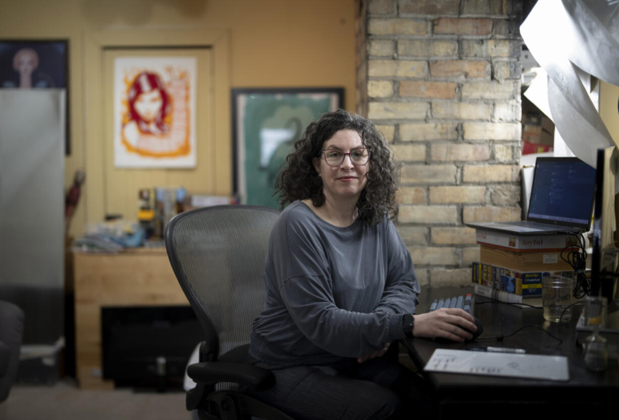 Software developer Lisa Mabley works from her home office on Monday April 15, 2024, in Minneapolis. Mabley was laid off from her job a year ago and applied to 300 places before finding a new job. Demand for tech workers rose during the digital transportation revolution. Now, those workers are being laid off or can&rsquo;t find employment.