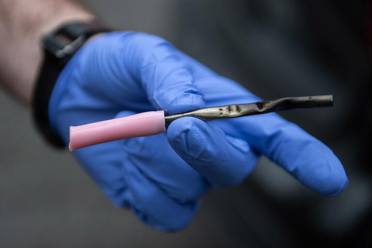 Officer Cole Larson of the Vancouver Police Department confiscates a device for smoking fentanyl from a motorist while on patrol on April 4.