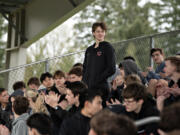 Camas High School&#039;s Chase McGee, standing, gets a round of applause from his teammates for setting the school&#039;s pole vault record, as seen Thursday afternoon, March 28, 2024.