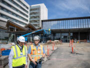 Dr. Jason Hanley, left, and site superintendent Joe Newman stand outside of a new emergency department building Friday at PeaceHealth Southwest Medical Center in Vancouver. The first section of the new emergency department is scheduled to open this summer.