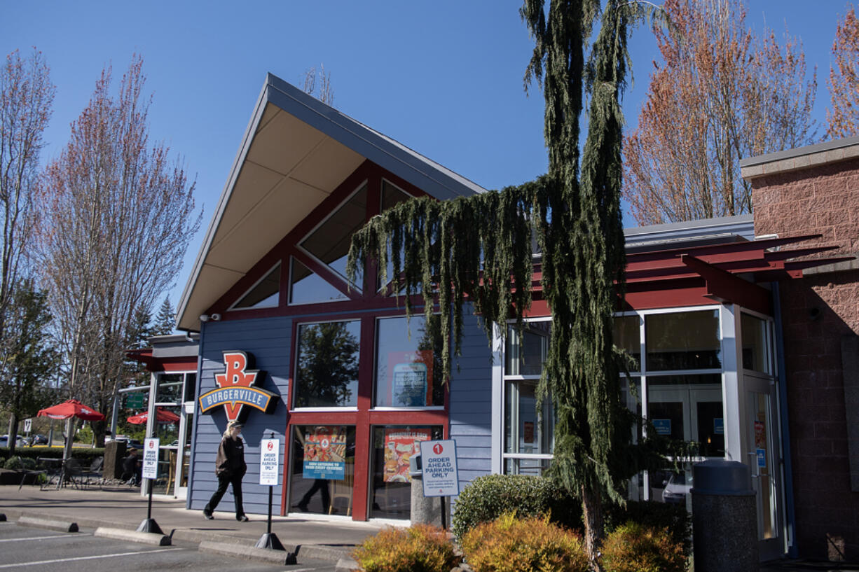 Burgerville crew member Ruby Runnels, 19, arrives for her shift at the local restaurant&rsquo;s Salmon Creek location Wednesday afternoon.