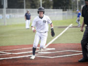 Teddy Wieczorek runs across home plante after scoring a run in the first inning of Seton Catholic's 8-4 loss to La Center in a Trico League baseball game at Harmony Sports Complex on Friday, April 12, 2024.