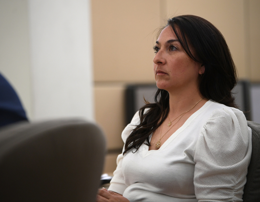 Vancouver Police Officer Andrea Mendoza listens to opening statements in her trial for gross misdemeanor assault Thursday at the Clark County Courthouse. Mendoza is accused of assaulting a man she was arresting and threatening to use a Taser on his genitals.