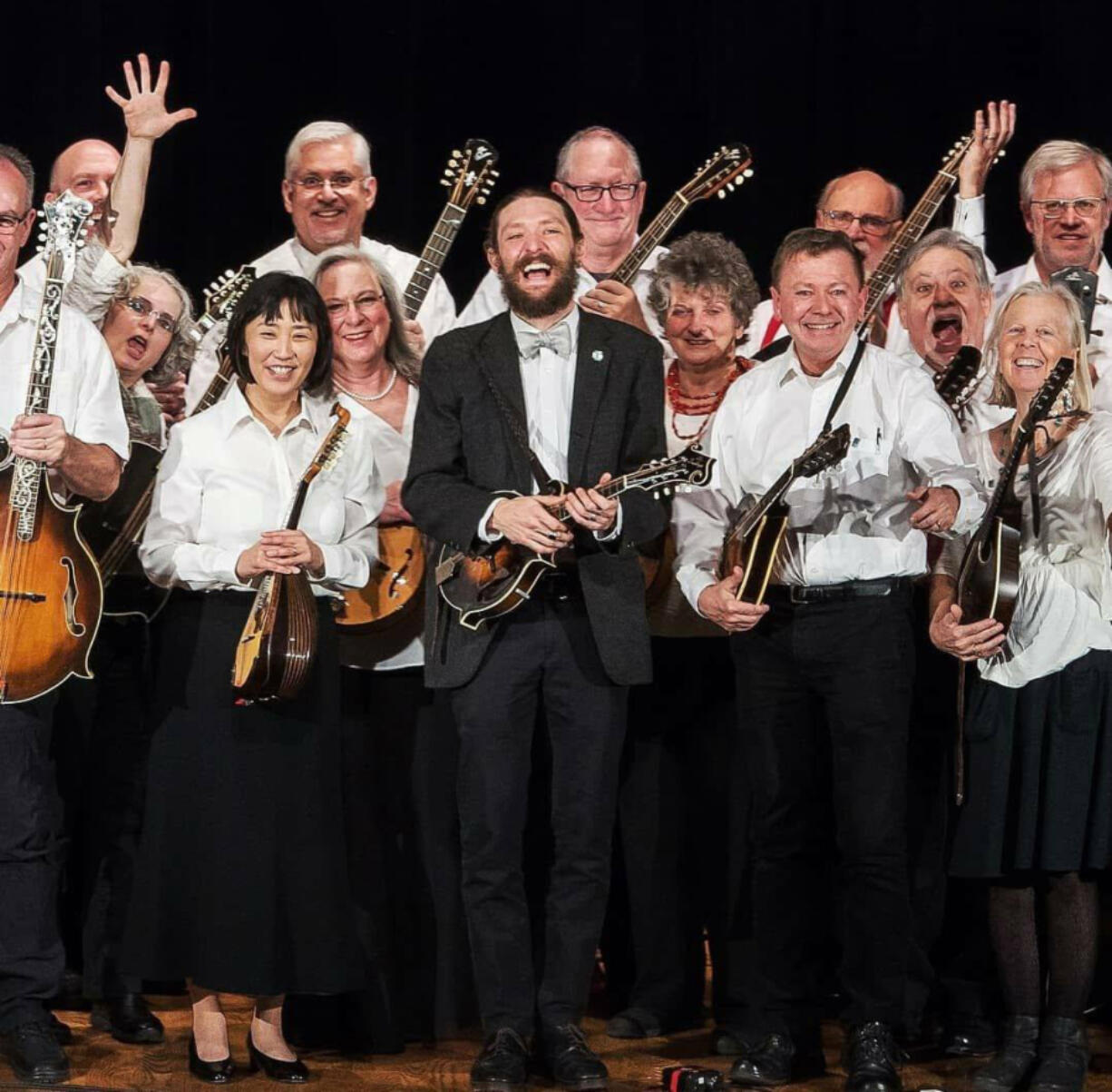 The lively Oregon Mandolin Orchestra, led by Christian McKee (center), features many Clark County players, including Andy Blitzer of Ridgefield (right of McKee).