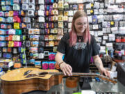 *LEADOPTION* Music World in Hazel Dell on Thursday hosted a free musical instrument string exchange where people could get new strings and their instrument restrung while supplies lasted.