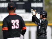 Union senior Ty Sutton (8) celebrates after hitting a double Friday, April 26, 2024, during Union’s 6-3 win against Battle Ground at Union High School.