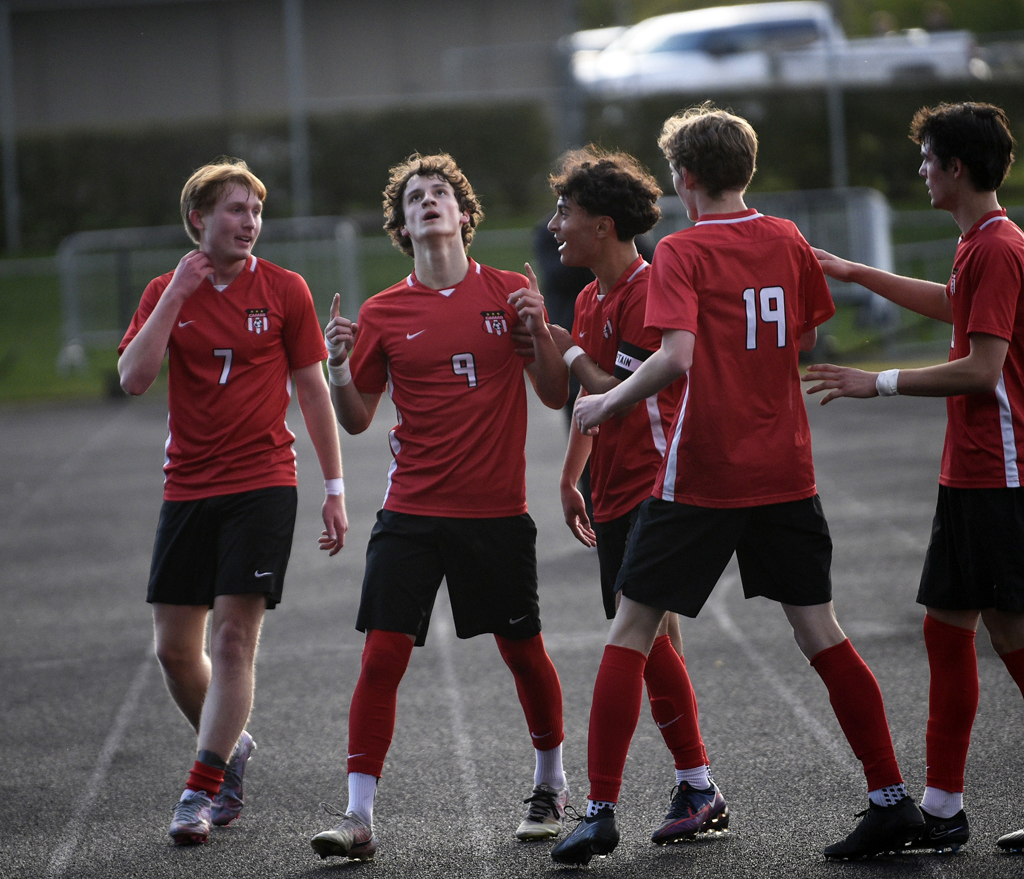 Cooper Schneider (9) of Camas celebrates his first-half goal with teammates during a 4A Greater St. Helens League boys soccer match against Union at Doc Harris Stadium in Camas on Monday, April 29, 2024.