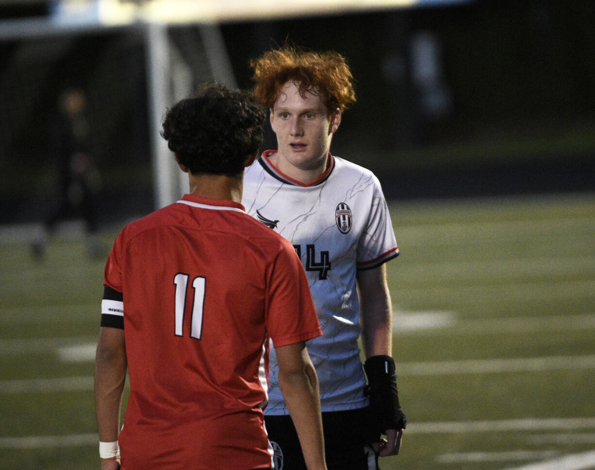 Caleb Putney (right) of Union talks with Shiven Friedeman of Camas during a 4A Greater St. Helens League boys soccer match at Doc Harris Stadium in Camas on Monday, April 29, 2024.