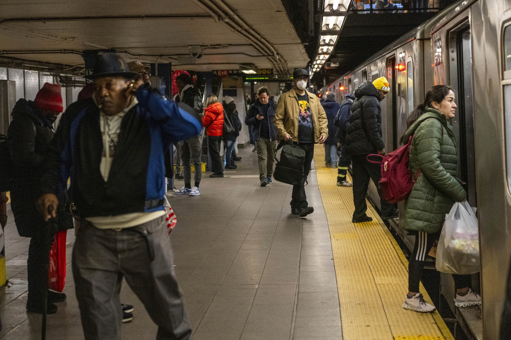 Commuters ride the subway as normal after an earthquake hit in the morning on Friday, April 5, 2024, in New York. An earthquake centered between New York and Philadelphia shook skyscrapers and suburbs across the northeastern U.S. Friday, causing no major damage but startling millions of people in an area unaccustomed to such tremors.