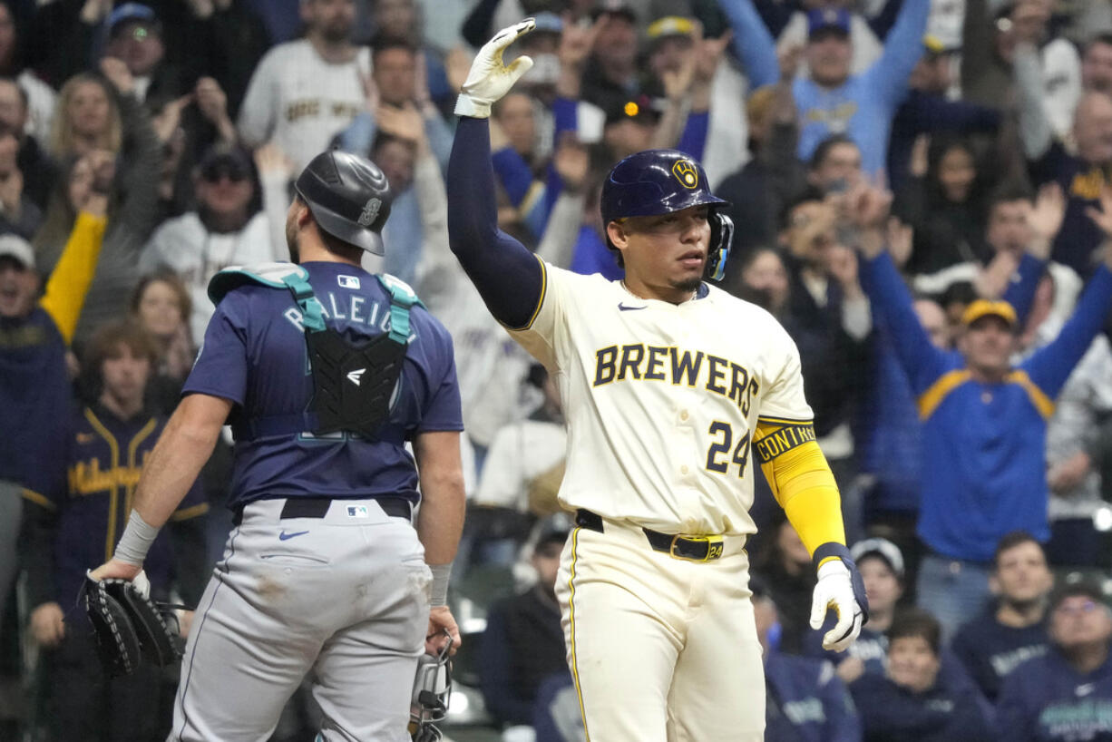 Milwaukee Brewers' William Contreras (24) celebrates a after walkoff walk during the ninth inning of a baseball game against the Seattle Mariners Friday, April 5, 2024, in Milwaukee.