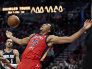 New Orleans Pelicans guard Trey Murphy III (25) reacts after scoring against the Portland Trail Blazers during the second half of an NBA basketball game in Portland, Ore., Tuesday, April 9, 2024.