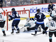 Winnipeg Jets' Tyler Toffoli (73) scores on Seattle Kraken goaltender Philipp Grubauer (31) during the third period of an NHL hockey game in Winnipeg, Manitoba on Tuesday April 16, 2024.