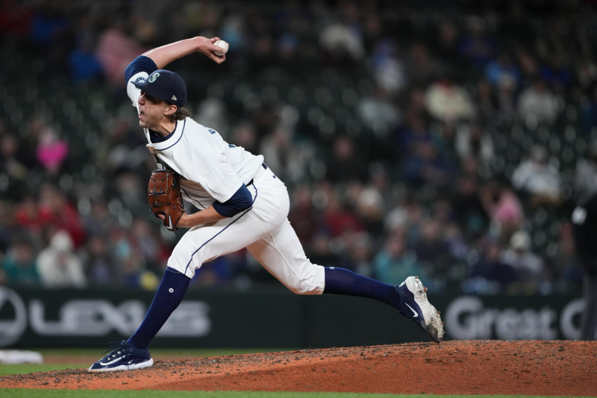 Seattle Mariners starting pitcher Logan Gilbert throws to a Cincinnati Reds batter during the seventh inning of a baseball game Tuesday, April 16, 2024, in Seattle.