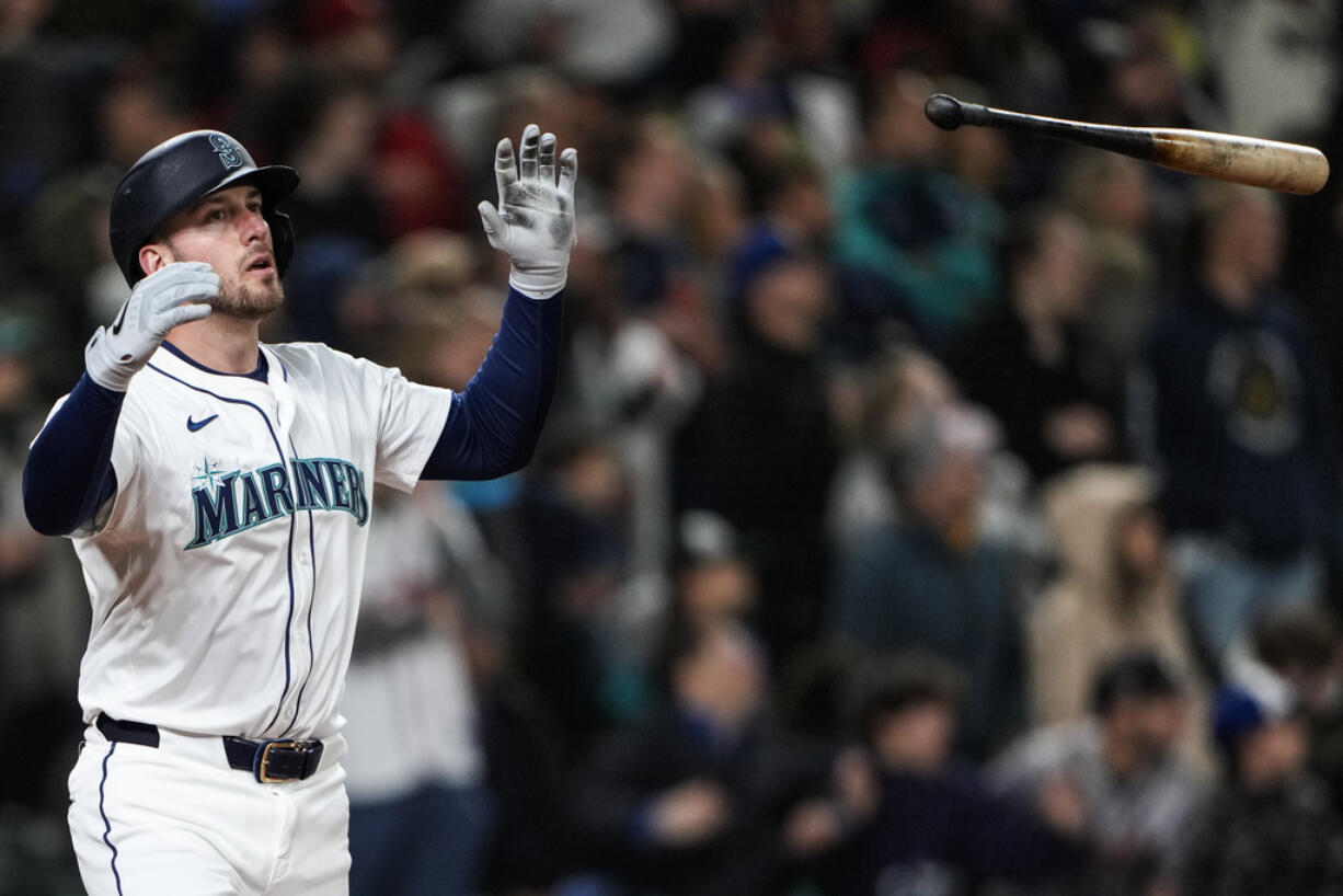 Seattle Mariners designated hitter Mitch Garver flips his bat after hitting a two-run walk-off home run against the Atlanta Braves during the ninth inning of a baseball game Monday, April 29, 2024, in Seattle. The Mariners won 2-1.