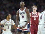 UConn forward Samson Johnson celebrates a basket during the second half of the NCAA college basketball game against Alabama at the Final Four, Saturday, April 6, 2024, in Glendale, Ariz.