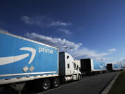 FILE - Amazon tractor trailers line up outside the Amazon distribution center on April 21, 2020 on Staten Island in New York. Two years after clenching a historic union victory at the Amazon facility, the Amazon Labor Union is divided, running out of money and fighting over an election that could determine who will lead the group in the near future.