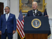 FILE - President Joe Biden speaks as Education Secretary Miguel Cardona listens at the White House, June 30, 2023, in Washington. Biden is traveling to Wisconsin Monday, April 8, 2024, to announce details of a new plan to help millions of people with their student loan debt. Last year, the U.S. Supreme Court foiled Biden&rsquo;s plan to provide hundreds of billions of dollars in student loan debt relief to millions. The visit comes a week after primary voting in the Midwest battleground state highlights weakness for him and Republican challenger Donald Trump.