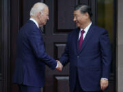 FILE - President Joe Biden greets China&#039;s President President Xi Jinping at the Filoli Estate in Woodside, Calif., Nov, 15, 2023, on the sidelines of the Asia-Pacific Economic Cooperative conference. Biden and Xi spoke Tuesday in their first call since their November summit in California, Chinese state media reported.