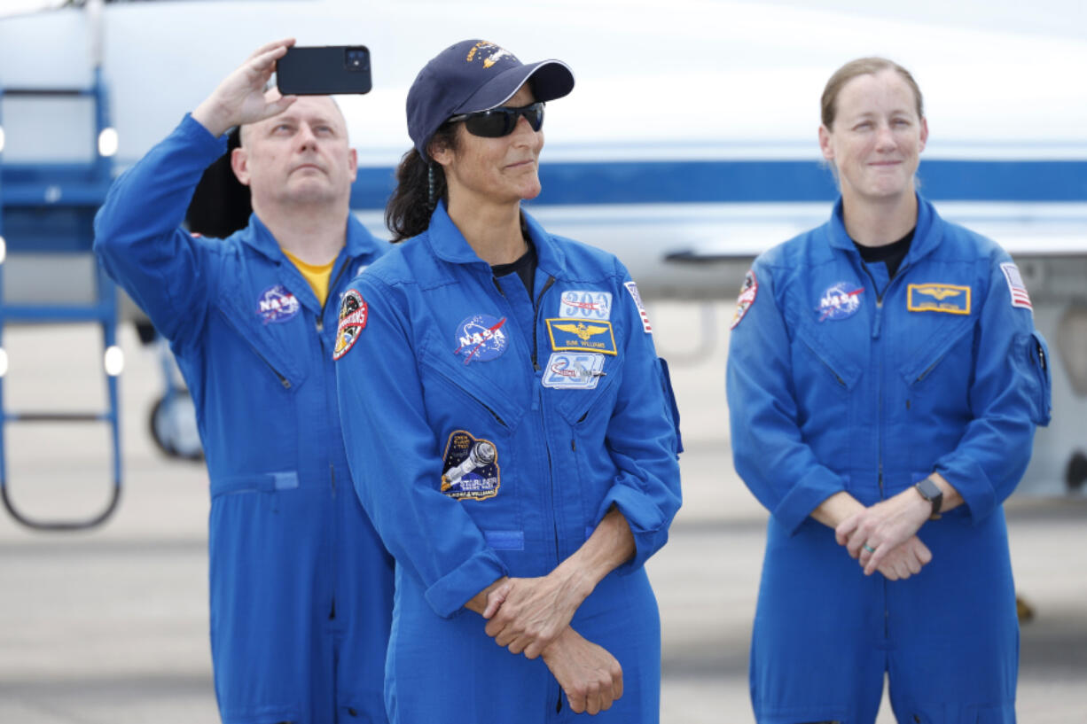 NASA astronaut Suni Williams with support crew in the background speaks to the media after arriving at the Kennedy Space Center, Thursday, April 25, 2024, in Cape Canaveral, Fla. The two test pilot crew will launch aboard Boeing&rsquo;s Starliner capsule atop an Atlas rocket to the International Space Station, scheduled for liftoff on May 6, 2024.