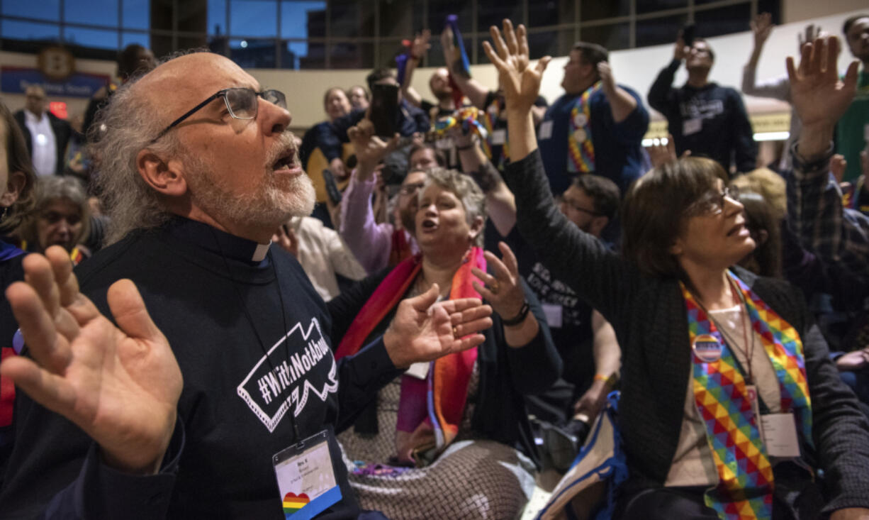 The Rev. K Karen, left, of St. Paul &amp; St. Andrew United Methodist Church in New York, joins other protesters in song and prayer outside the United Methodist Church&rsquo;s special session of the general conference in St. Louis on Feb. 26, 2019. Since 2019, the denomination has lost about one-fourth of its U.S. churches in a breakup focused in large part on whether to accept same-sex marriage and ordination of LGBTQ clergy.