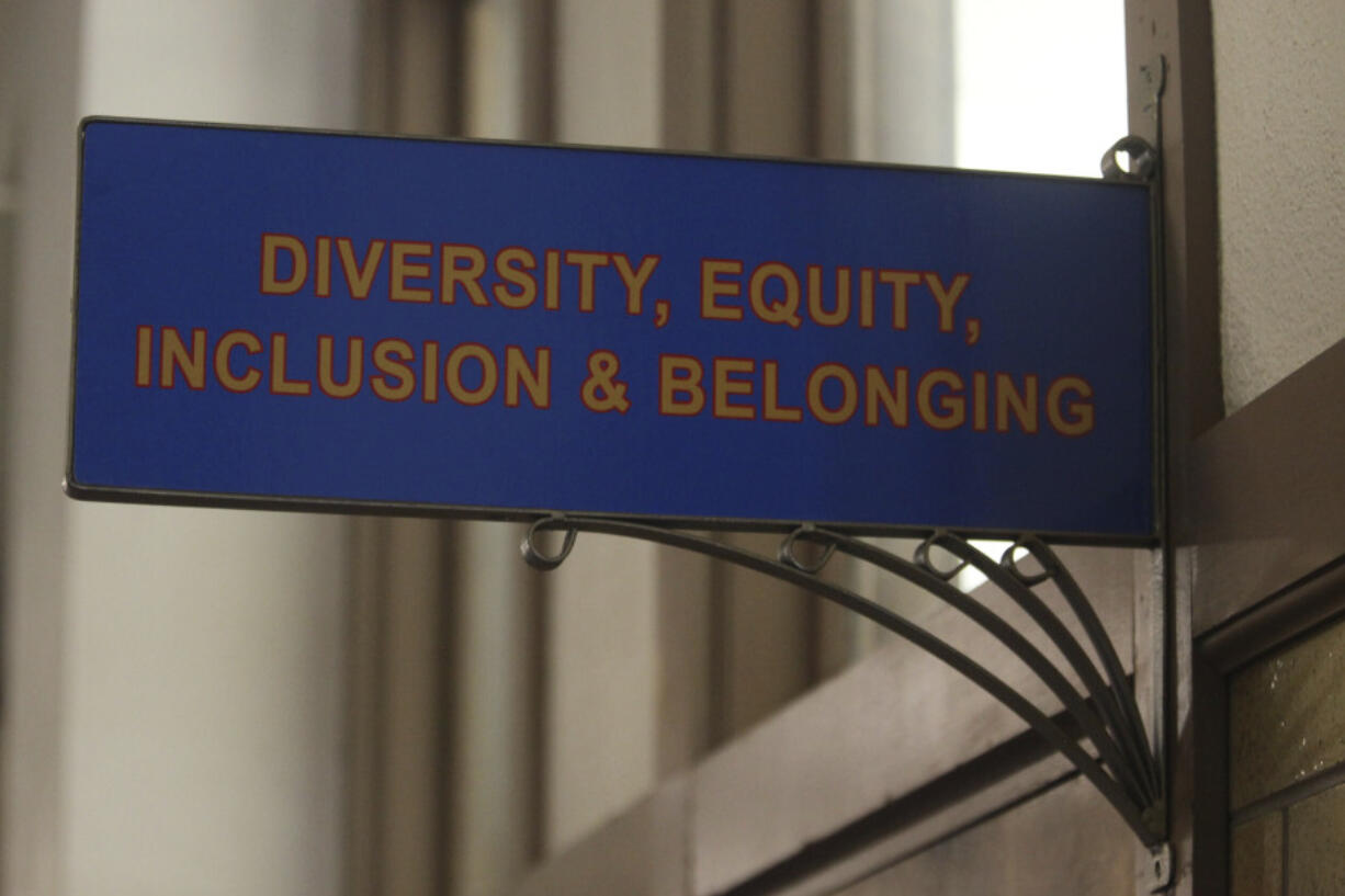 FILE - The sign above the door to the Office of Diversity, Equity, Inclusion and Belonging inside the main administration building on the main University of Kansas campus is seen on Friday, April 12, 2024, in Lawrence, Kan. A conservative quest to limit diversity, equity and inclusion initiatives is gaining momentum in state capitals and college governing boards, with officials in about one-third of the states now taking some sort of action against it.