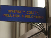 FILE - The sign above the door to the Office of Diversity, Equity, Inclusion and Belonging inside the main administration building on the main University of Kansas campus is seen on Friday, April 12, 2024, in Lawrence, Kan. A conservative quest to limit diversity, equity and inclusion initiatives is gaining momentum in state capitals and college governing boards, with officials in about one-third of the states now taking some sort of action against it.