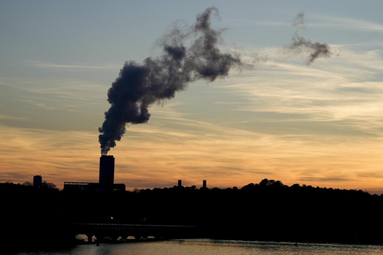 FILE - The Marshall Steam Station coal power plant operates March 3, 2024, near Mooresville, N.C. A rule issued April 24, 2024, by the Environmental Protection Agency would force power plants fueled by coal or natural gas to capture smokestack emissions or shut down.