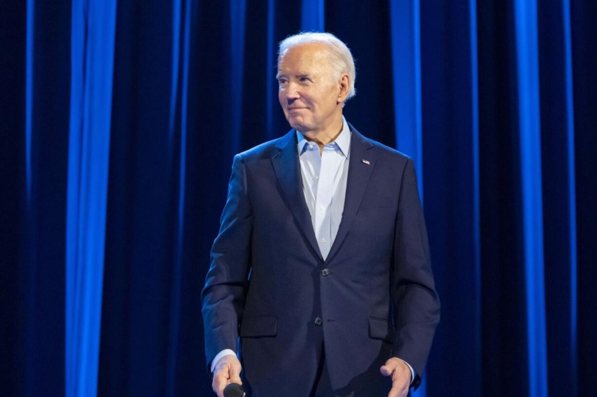 President Joe Biden stands with former presidents Barack Obama and Bill Clinton participate in a fundraising event with Stephen Colbert at Radio City Music Hall, Thursday, March 28, 2024, in New York.