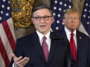 Speaker of the House Mike Johnson, R-La., speaks as Republican presidential candidate former President Donald Trump listens during a news conference, Friday, April 12, 2024, at Mar-a-Lago in Palm Beach, Fla.