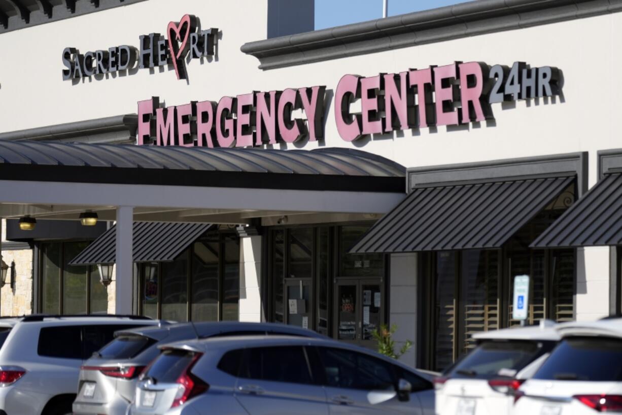 Sacred Heart Emergency Center is pictured Friday, March 29, 2024, in Houston. Complaints about pregnant women being turned away from emergency rooms spiked in the months after states began enacting strict abortion laws following the 2022 U.S. Supreme Court decision overturning Roe v. Wade. At Sacred Heart Emergency Center in Houston, front desk staff refused to check-in one woman after her husband asked for help delivering her baby. She miscarried in a restroom toilet in the emergency room lobby while her husband called 911 for help. (AP Photo/David J.