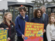 Swedish climate activist Greta Thunberg, left, joins youths from Portugal during a demonstration outside the European Court of Human Rights Tuesday, April 9, 2024 in Strasbourg, eastern France. Europe&rsquo;s highest human rights court will rule Tuesday on a group of landmark climate change cases aimed at forcing countries to meet international obligations to reduce greenhouse gas emissions. The European Court of Human Rights will hand down decisions in a trio of cases brought by a French mayor, six Portuguese youngsters and more than 2,000 elderly Swiss women who say their governments are not doing enough to combat climate change.