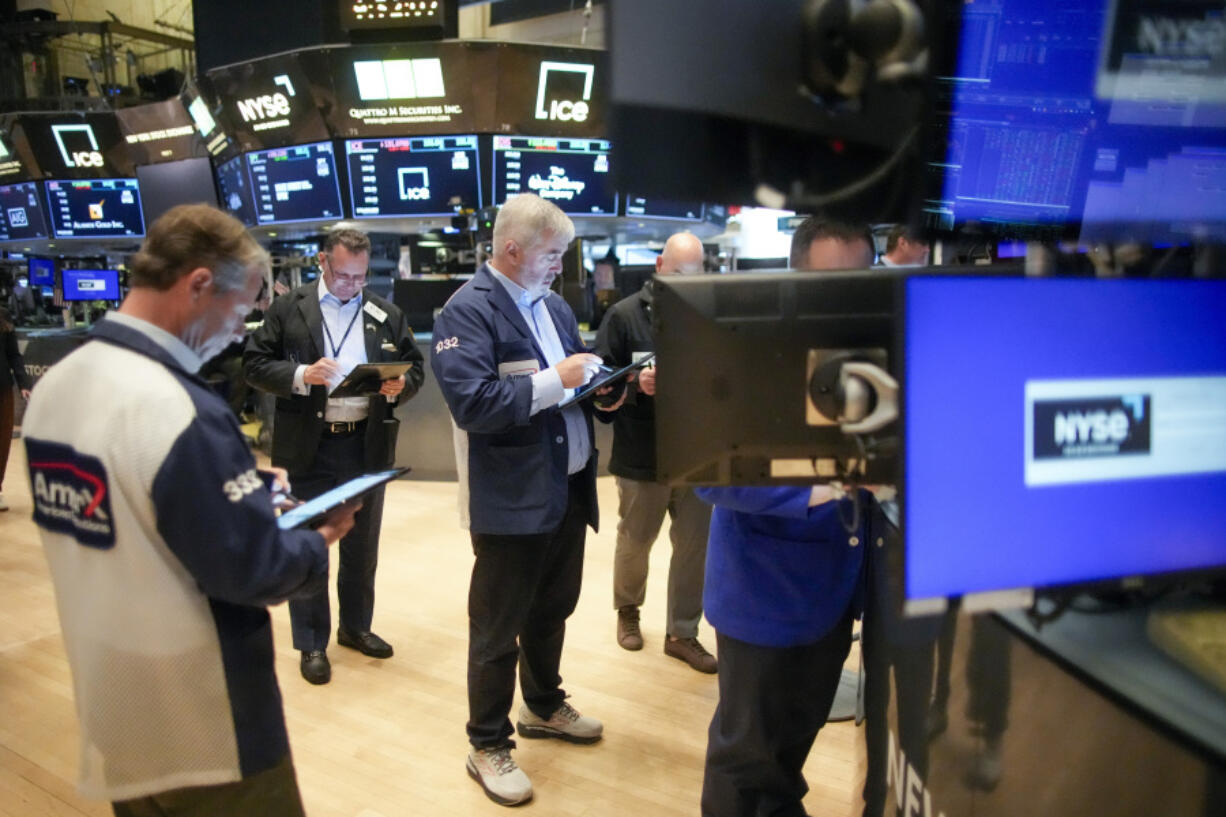 Traders work on the floor of the New York Stock Exchange shortly after the opening bell, Wednesday, April 24, 2024, in New York.