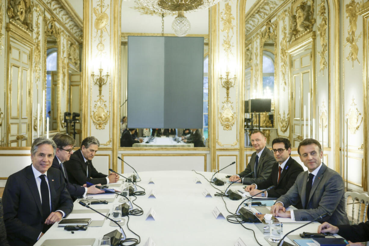 U.S. Secretary of State Antony Blinken, left, meets French President Emmanuel Macron at the Elysee Palace in Paris, Tuesday, April 2, 2024. Blinken is in Paris for talks on Ukraine, Gaza and stabilizing Haiti.