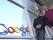 FILE - Google co-founders Sergey Brin, left, and Larry Page pose at company headquarters Jan.15, 2004, in Mountain View, Calif. Page and Brin unveiled Gmail 20 years ago on April Fool&rsquo;s Day.