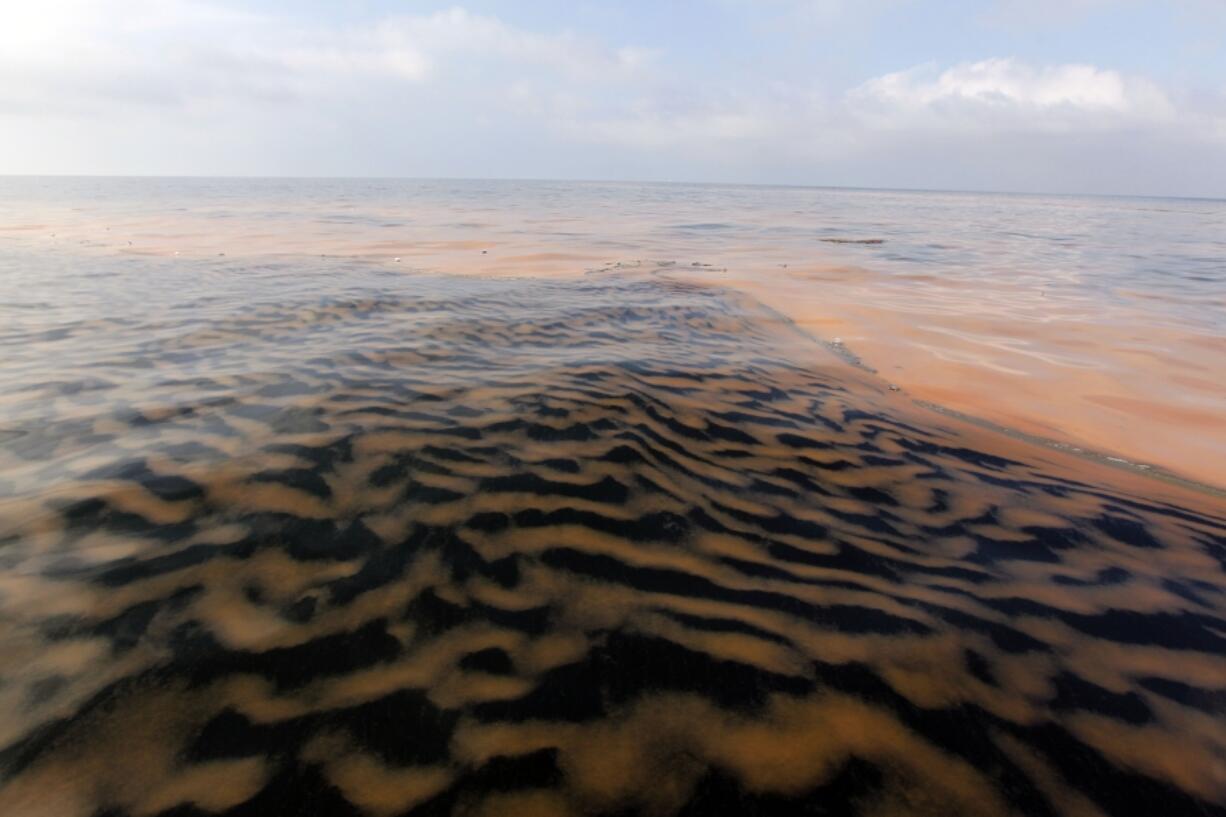 FILE - Oil makes a pattern in the waters of Chandeleur Sound, La., May 6, 2010.