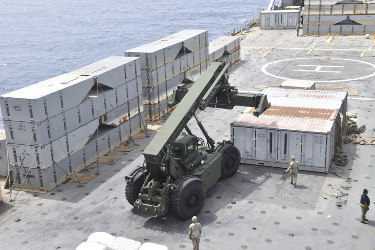 This undated photo released early Tuesday, April 30, 2024, by the U.S. military&rsquo;s Central Command shows construction off a floating pier in the Mediterranean Sea off the Gaza Strip. A U.S. Navy ship involved in the American-led effort to bring more aid into the besieged Gaza Strip is off shore from the enclave, slowly building out a floating platform for the operation, satellite photos analyzed Monday, April 29, 2024, by The Associated Press show. (U.S.