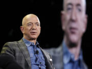 FILE - Amazon CEO Jeff Bezos speaks at the Amazon re:MARS convention in Las Vegas on June 6, 2019.  Most news organizations hold its journalists to strict ethical standards to avoid conflicts of interest either real or perceived. Is the same true for its bosses?