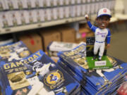 A Hank Aaron bobblehead commemorating the 50th anniversary of Aaron breaking Babe Ruth&rsquo;s career home run record is shown before a baseball game between New York Mets and Atlanta Braves Monday, April 8, 2024, in Atlanta. Aaron hit his 715th home run on April 8, 1974.