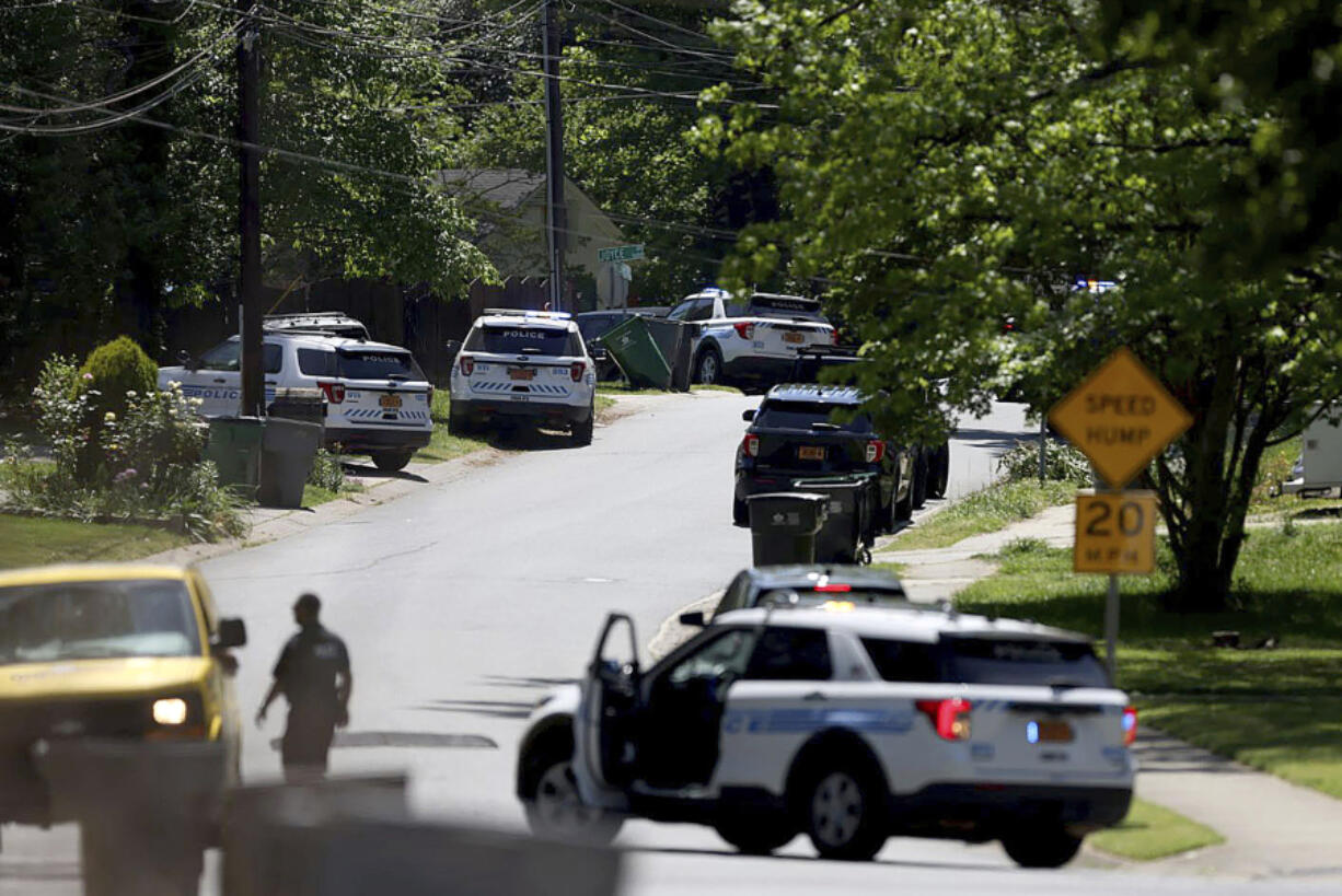 Police work at the scene of a shooting Monday in east Charlotte, N.C.