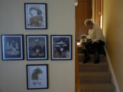 Deb Robertson sits with her 12 year-old dog Mazi in the hallway before a meal with family and friends at her Lombard, Ill., home Saturday, March 23, 2024. Robertson didn&rsquo;t cry when she learned two months ago that the cancerous tumors in her liver were spreading, portending a tormented death. But later, she cried after receiving a call that a bill moving through the Illinois Legislature to allow certain terminally ill patients to end their own lives with a doctor&rsquo;s help had made progress.