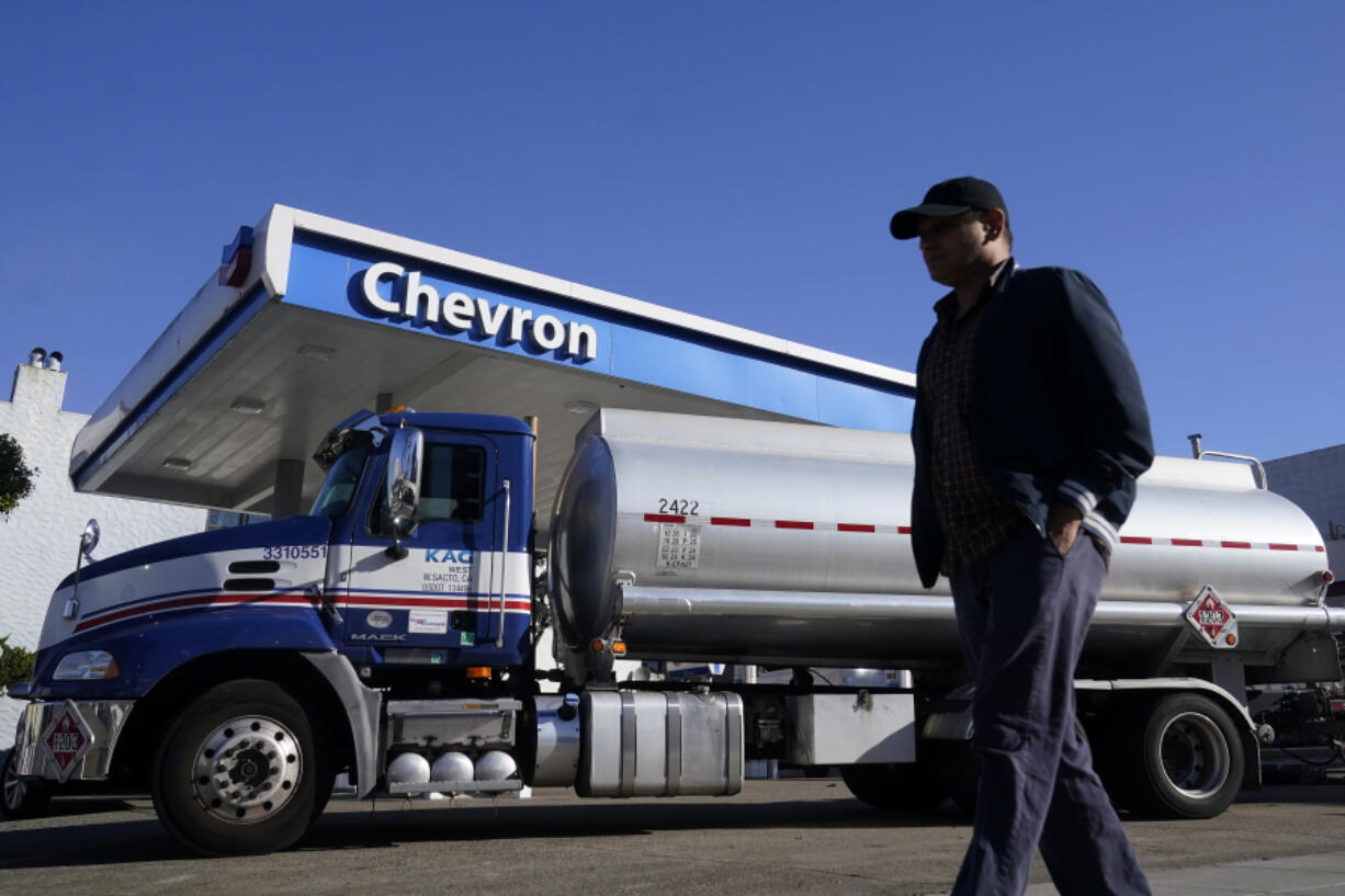FILE - A man walks past a tanker at a Chevron gas station in San Francisco, Oct. 23, 2023. On Thursday, April 11, 2024, the Labor Department releases producer prices data for March.