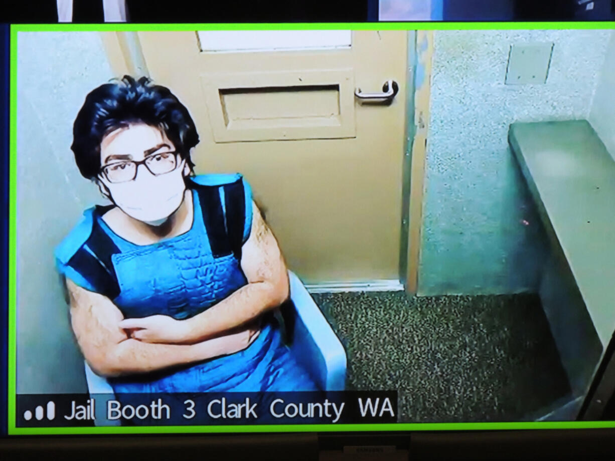 Julio Cesar Segura, shown at 2022 court appearance, then 20, appears in January 2022 in Clark County Superior Court in connection with the death of off-duty Vancouver police Officer Donald Sahota. Jury selection in Segura&rsquo;s murder trial is set to begin today.