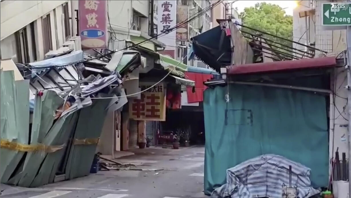 In this image from a video, roads in Hualien, Taiwan are cordoned off after a cluster of earthquakes struck the island early Tuesday, April 23, 2024. There were no reports of casualties in the quakes, although there were further damages to two multi-story buildings that had been evacuated following a magnitude 7.4 quake that hit the island earlier this month, killing 13 people and injuring over 1,000.