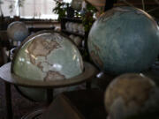 Various size of globes are displayed at the Bellerby &amp; Co. Globemakers studio in London.