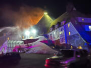 Firefighters extinguish a fire at Oregon&#039;s historic Timberline Lodge, which was featured in Stanley Kubrick&#039;s 1980 film &quot;The Shining,&quot; Thursday evening, April 18, 2024, in Government Camp, Ore.