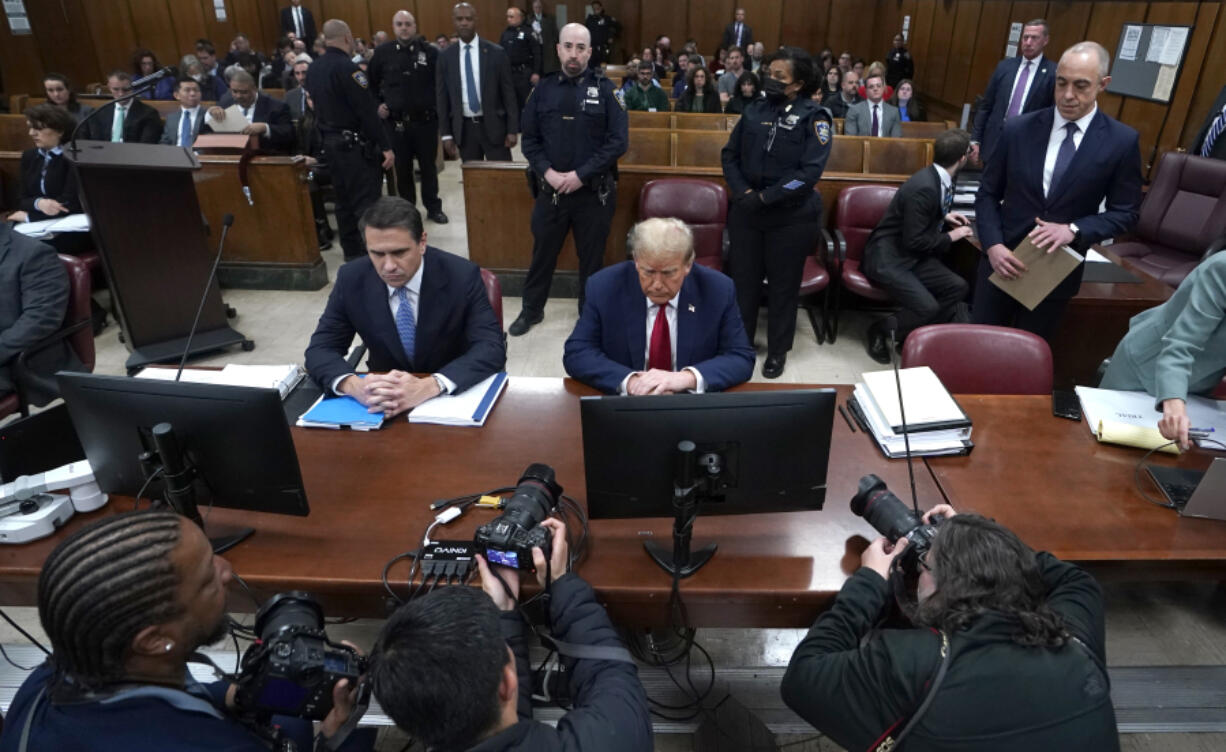 Former US President Donald Trump, with lawyer Todd Blanche, left, attends his trial for allegedly covering up hush money payments linked to extramarital affairs, at Manhattan Criminal Court in New York City, Tuesday April 23, 2024. Before testimony resumes Tuesday, the judge will hold a hearing on prosecutors&rsquo; request to sanction and fine Trump over social media posts they say violate a gag order prohibiting him from attacking key witnesses. (Timothy A.