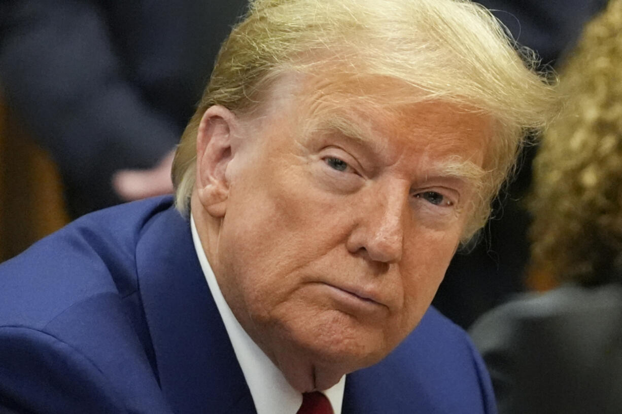 FILE - Former President Donald Trump awaits the start of a pre-trial hearing with his defense team at Manhattan criminal court, Monday, March 25, 2024, in New York. A dozen Manhattan residents are soon to become the first Americans ever to sit in judgment of a former president charged with a crime. Jury selection is set to start Monday in former President Donald Trump&rsquo;s hush-money trial.