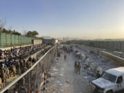 The bombing area at Abbey Gate is pictured August 26, 2021,  in Kabul, Afghanistan, before the blast. A review released Monday, April 15, 2024, says the suicide bombing at the Kabul airport that killed U.S. troops and Afghans in August 2021 was not preventable, and the &ldquo;bald man in black&rdquo; spotted by U.S. service members the morning of the attack was not the bomber. (U.S.